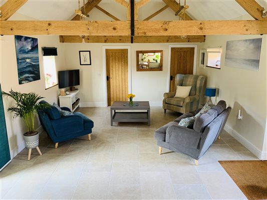 Sitting Room with grey sofa and blue chair